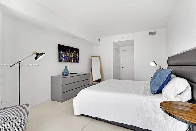 bedroom featuring light tile patterned floors