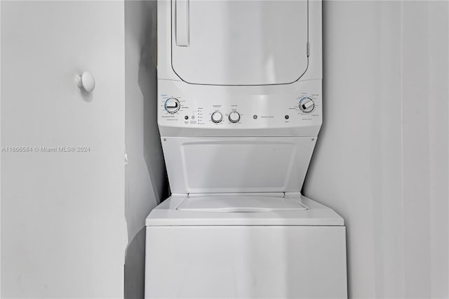 laundry area with stacked washer / dryer