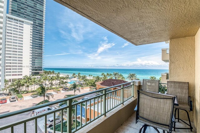 balcony featuring a water view