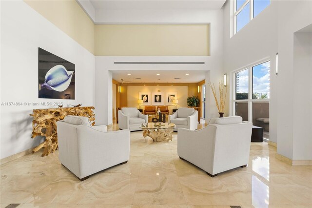 living room featuring a high ceiling