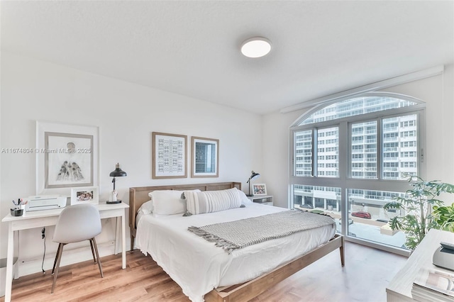 bedroom with light wood-type flooring