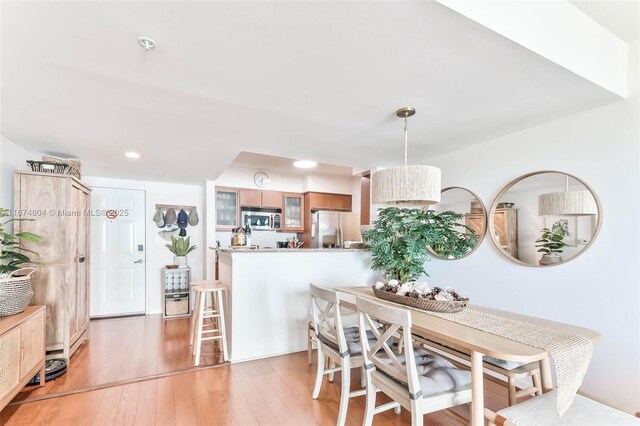 dining room with light hardwood / wood-style flooring