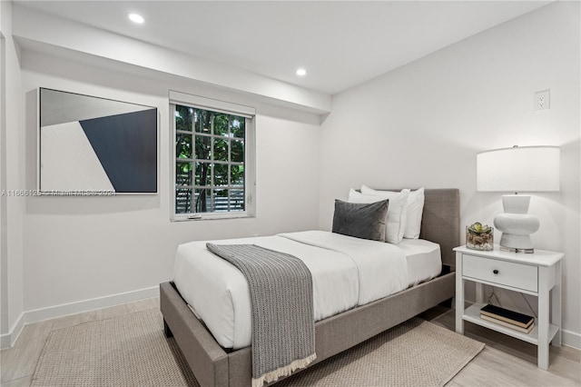 bedroom with light wood-type flooring