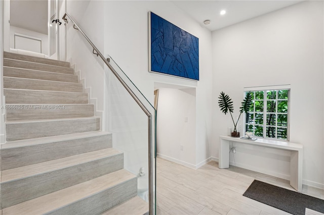 stairway featuring hardwood / wood-style floors