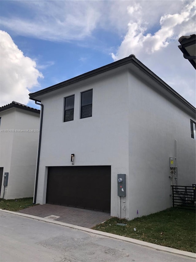 view of property exterior with a garage