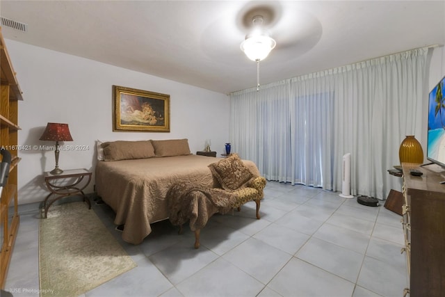 bedroom featuring light tile patterned flooring and ceiling fan