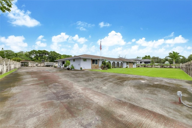 ranch-style house with a front lawn