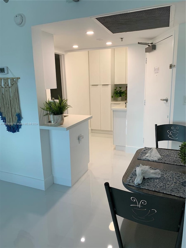 kitchen featuring white cabinets