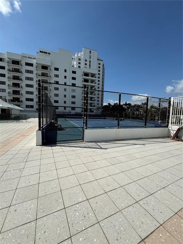 view of patio / terrace featuring tennis court