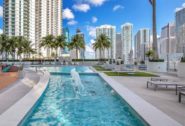 view of swimming pool featuring pool water feature