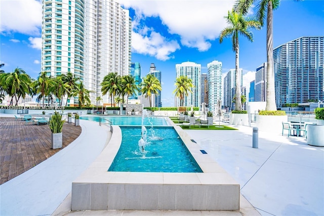 view of pool with pool water feature