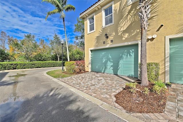 exterior space with a garage