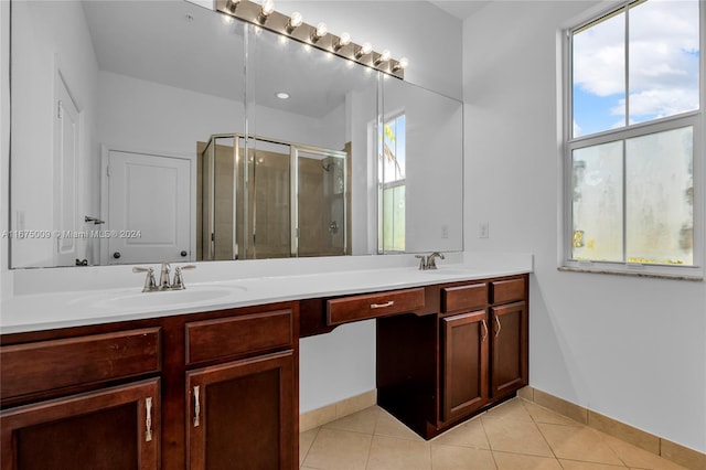 bathroom featuring vanity, tile patterned floors, and an enclosed shower