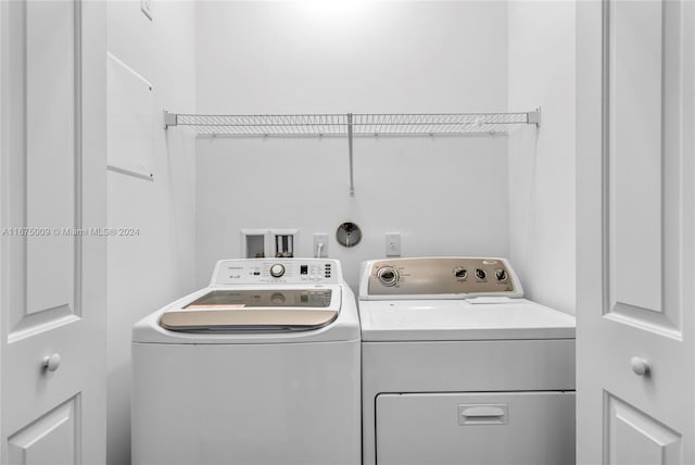 washroom featuring washer and dryer