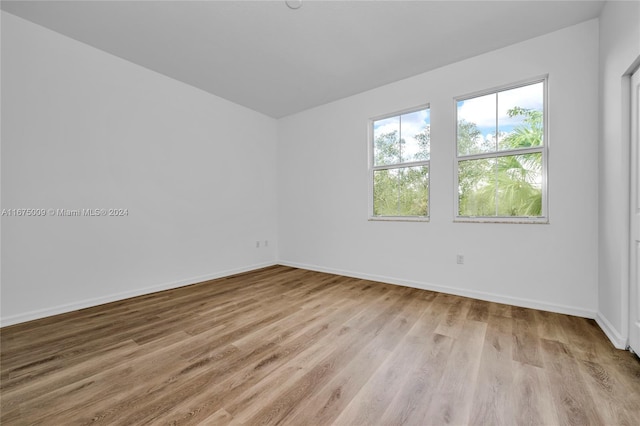 spare room featuring light hardwood / wood-style flooring