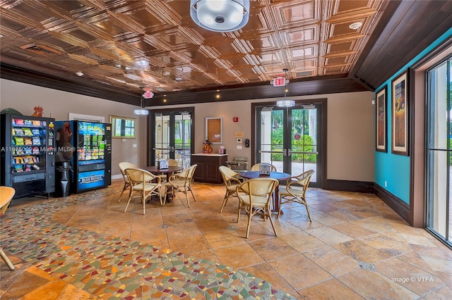 dining area featuring ornamental molding and french doors