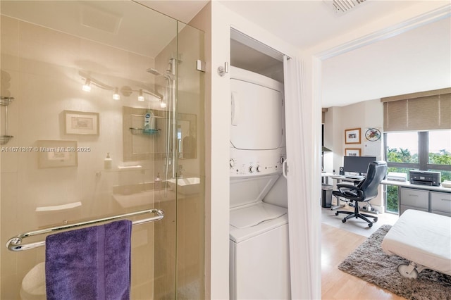 bathroom featuring hardwood / wood-style floors and an enclosed shower