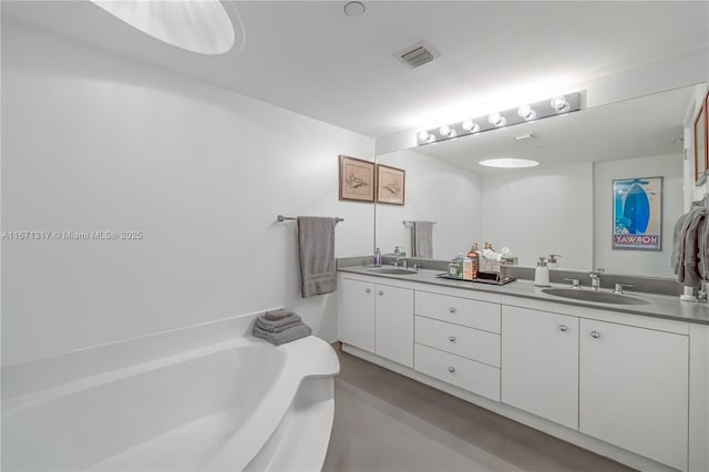 bathroom featuring a tub and vanity