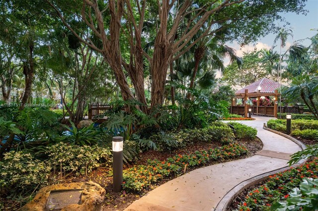 view of patio featuring a swimming pool with hot tub