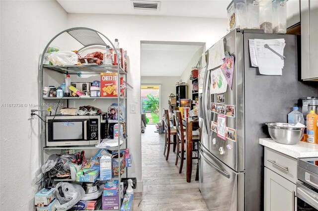 kitchen featuring light wood-type flooring and stainless steel appliances