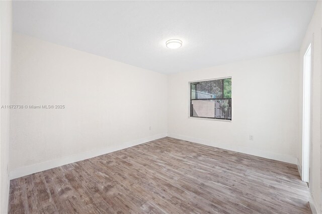 bedroom featuring wood-type flooring and a textured ceiling