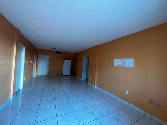 empty room with light tile patterned floors