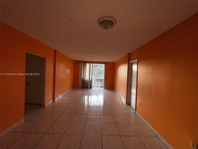 empty room with light tile patterned floors