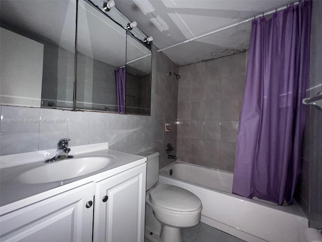 full bathroom with vanity, tile walls, shower / bathtub combination with curtain, toilet, and backsplash