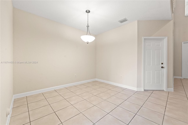 unfurnished room featuring light tile patterned flooring