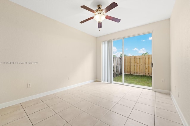 spare room with light tile patterned flooring and ceiling fan