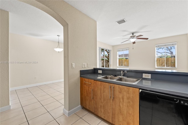 kitchen featuring ceiling fan, sink, dishwasher, light tile patterned floors, and a textured ceiling