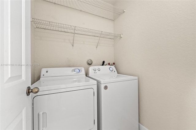 clothes washing area featuring washing machine and clothes dryer