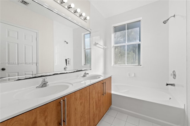 bathroom with bathing tub / shower combination, tile patterned floors, and vanity