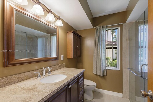 spare room featuring dark hardwood / wood-style flooring, ceiling fan, and a healthy amount of sunlight