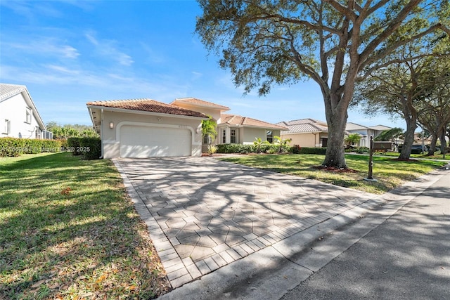 view of front of home with a garage and a front yard