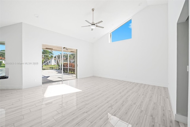 unfurnished room featuring light wood-type flooring, high vaulted ceiling, and ceiling fan