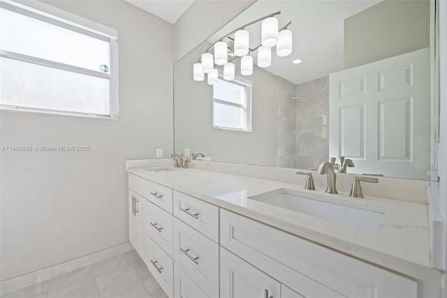 bathroom with tile patterned floors and vanity