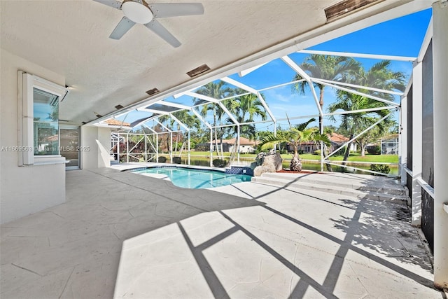 view of swimming pool with a patio area, ceiling fan, and a lanai