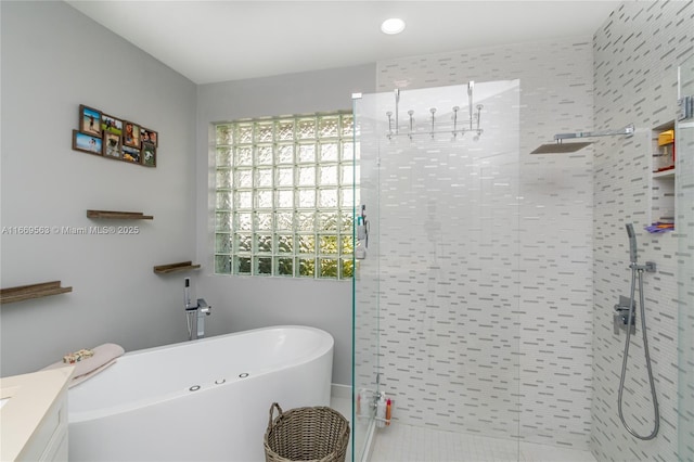 bathroom with plus walk in shower and vanity