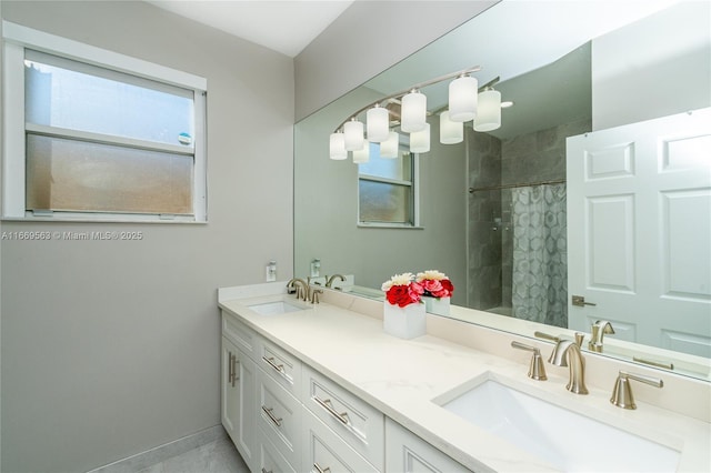 bathroom with vanity and curtained shower