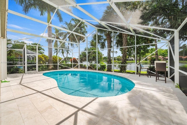 view of pool with a lanai, a water view, and a patio