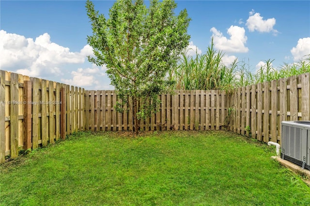 view of yard featuring central AC