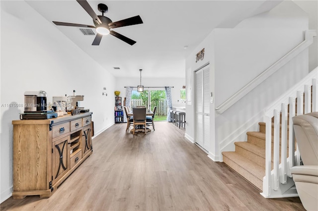 interior space with hardwood / wood-style flooring and ceiling fan