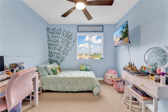 bedroom with light carpet and ceiling fan