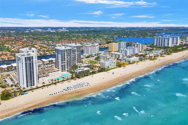 birds eye view of property featuring a view of the beach and a water view