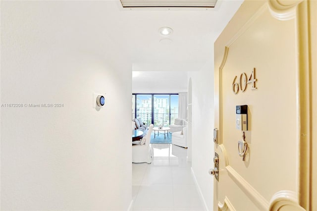 hallway featuring light tile patterned floors