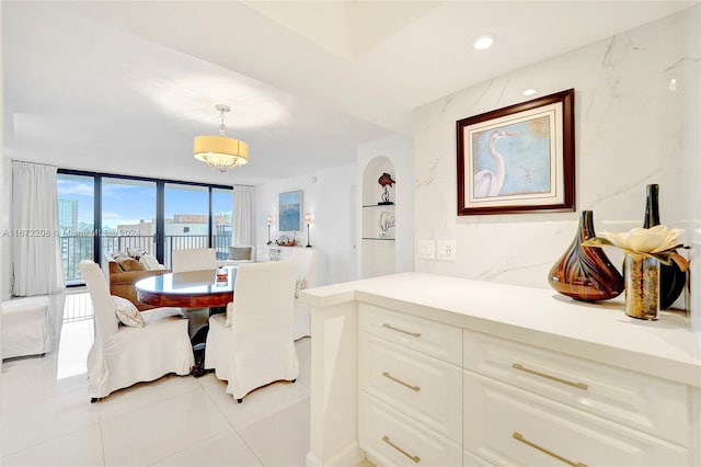 dining space with light tile patterned floors