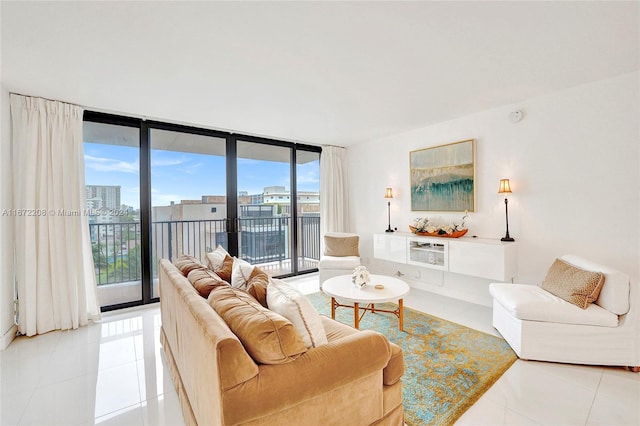 living room with a wall of windows, light tile patterned floors, and a healthy amount of sunlight