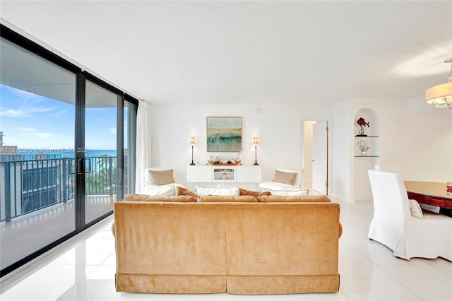 living room featuring floor to ceiling windows and light tile patterned floors