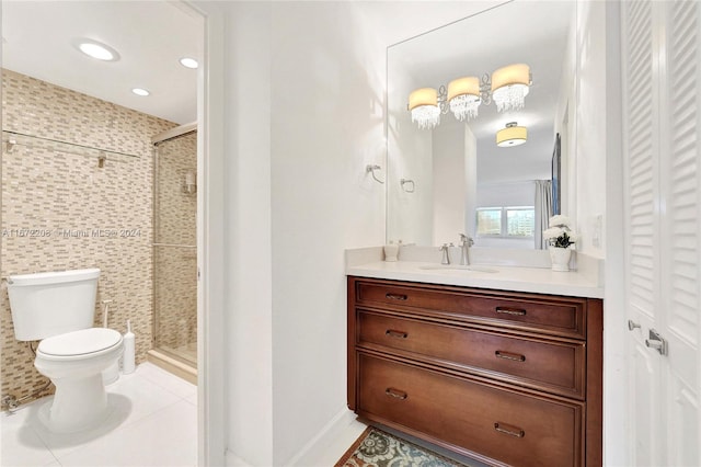 bathroom featuring a shower with door, tile patterned floors, vanity, and toilet